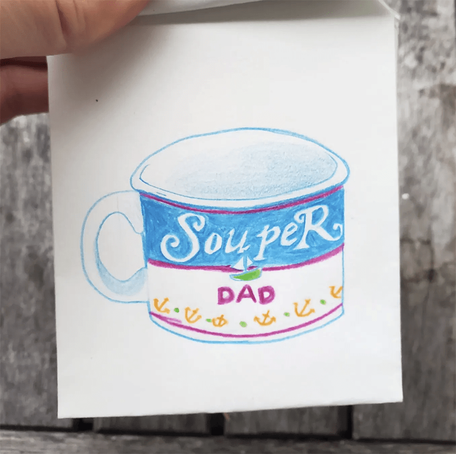 The second page of the small booklet. It shows a drawing of a mug that has the text "Souper Dad" on it.
