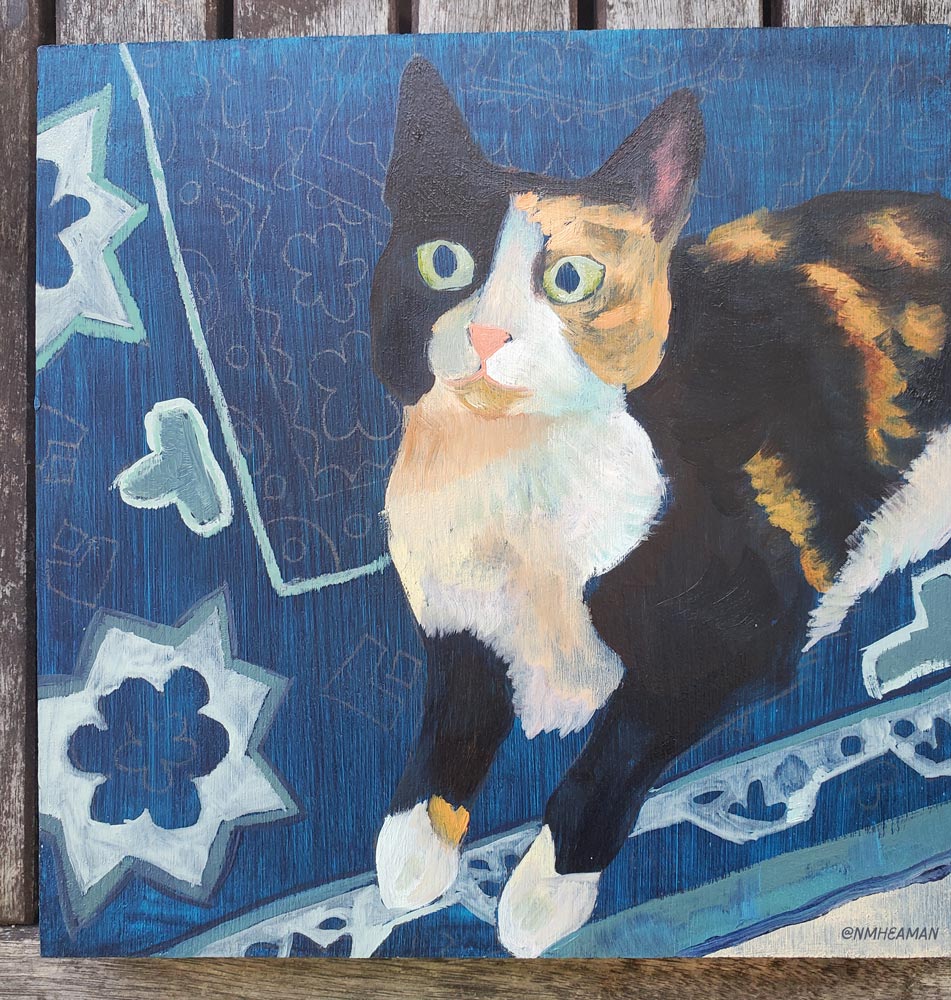 A photo of the in-progress oil painting, where some colours are laid down but mostly you still see the underpainting, a solid blue.
