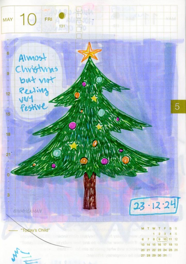A gel pen drawing of a Christmas tree with colourful decorations and a star on top. Writing next to it reads: “Almost Christmas but not feeling very festive.”
